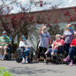 Residents wave at Sundale Memorial Day parade
